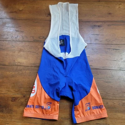 Culotte con tirantes de ciclismo Rosti XL para hombre 8" 16" (8,5/10) azul naranja poliamida almohadilla mediana Foto 1 de 4