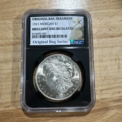 Dólar Morgan de $1 de 1921, graduado brillante-sin circular por fragmento de bolsa NGC Foto 1 de 4