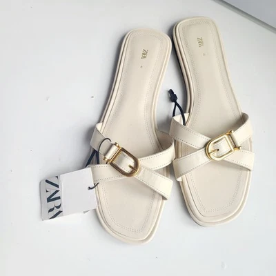 Sandálias planas Zara femininas tamanho 10 couro Abierto creme marfim NOVA tira OURO - Imagem 1 de 4