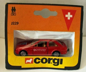 Corgi juniors rojo suizo acelga fahrschule Ford Escort J229 muy raro problema de exportación - Imagen 1 de 2