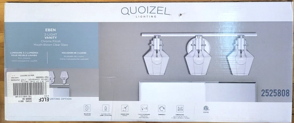 Tocador de transición Quoizel Lighting 24" Eben 3 luces con vidrio soplado transparente Foto 1 de 3