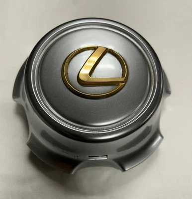 42603-60231 OEM FÁBRICA LEXUS TAPA CENTRAL ACABADO GUNMETAL LOGOTIPO DORADO 1999-01 LX470 Foto 1 de 2