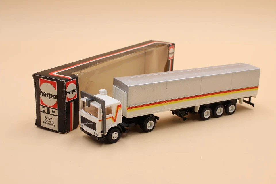 Herpa Volvo F12 flatbed/tarpaulin semi-trailer white/silver 901271 1:87 /HU24868 - Image 1 of 1