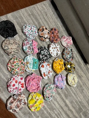 20-22 pañales de tela nuevos, nunca usados, además de insertos y bolsa húmeda/seca!  Foto 1 de 2