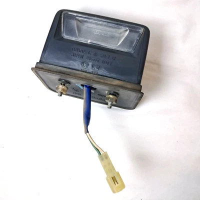 Toyota Camry Wagon 1987-1991 lámpara de luz de matrícula trasera con carcasa OEM Foto 1 de 4
