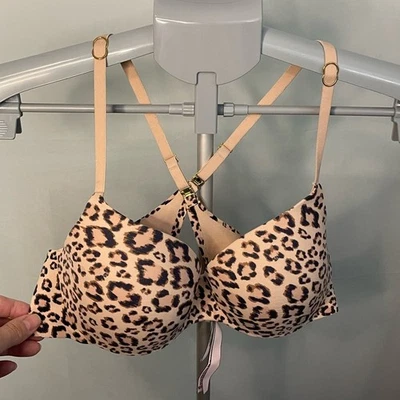 Sujetador Victoria's Secret estampado de leopardo con detalles dorados 34C Foto 1 de 4