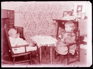 LATE 1800s or EARLY 1900s GLASS NEGATIVE,  TWO VERY YOUNG CHILDREN HAVING TEA - Picture 1 of 2