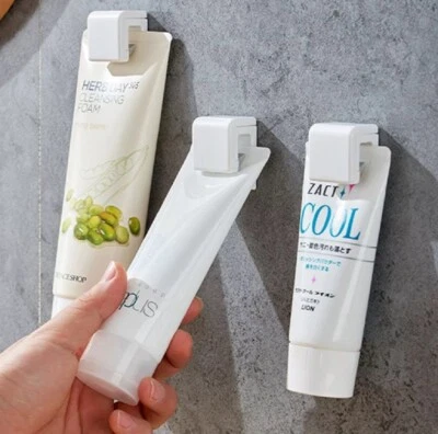 Paquete de 4 soportes de clip para pasta de dientes - estante de baño que ahorra espacio para tubos y limpiadores Foto 1 de 4