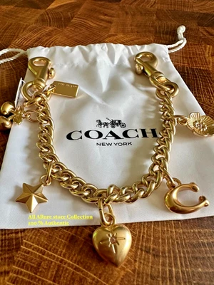 Cadena Swagger Coach para mujer con dijes CAX00 dorada Foto 1 de 4