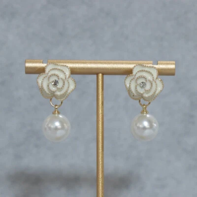 Pendientes de perlas para mujer con lazo de mariposa de nicho aretes de moda y lujosos Foto 1 de 4