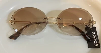 Gafas de sol ovaladas sin marco SPEXX para mujer color ámbar Foto 1 de 4