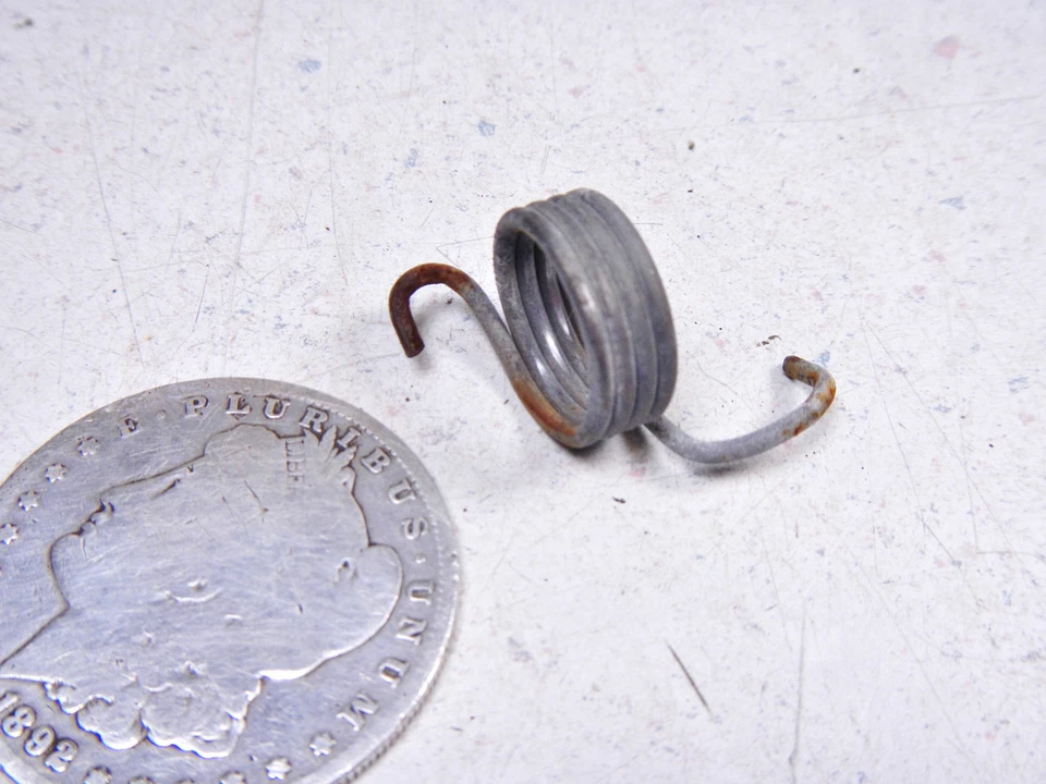 74 HONDA CB360 LEFT SIDE FOOTPEG FOOT PEG STEP RETURN SPRING  - Image 1 of 1