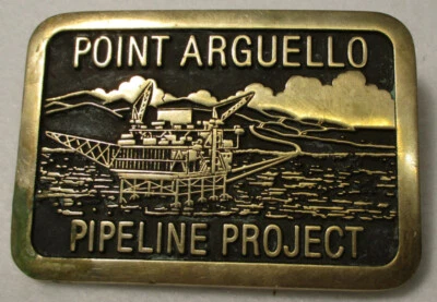 Hebilla de cinturón vintage Point Arguello Pipeline Project 1987 Ana Cortés latón funciona Foto 1 de 4