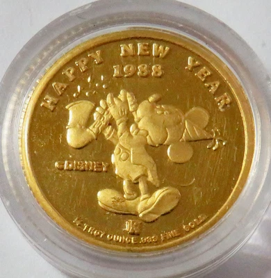 1987 -1988 GOLD DISNEY MERRY CHRISTMAS 1988 HAPPY NEW YEAR 1/4oz IN CAPSULE - Image 1 of 2