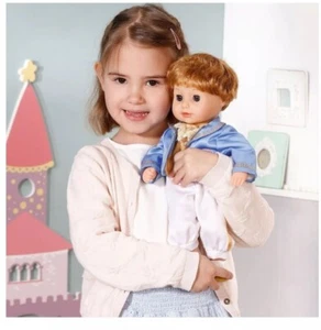 This Baby Annabell Little Sweet Prince Doll Features a Wavy Silver Hair and Gold - Picture 1 of 7