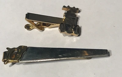 2 clips de amarre relacionados con el comercio, sierra para madera, válvula de plomería Foto 1 de 2