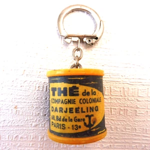 PORTE CLES DES ANNEES 60 KEYCHAIN - BOITE THE COMPAGNIE COLONIALE PH RECTO-VERSO - Imagen 1 de 3