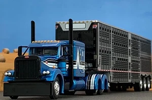 1/64 DCP PETERBILT 379 FLAT TOP W/ WILSON TRI AXLE CATTLE TRAILER - Picture 1 of 7