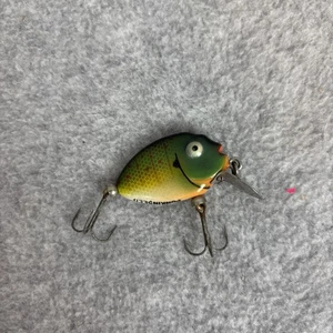 Vintage HEDDON TINY PUMPKIN SEED Angelköder grün gelb orange - Bild 1 von 3