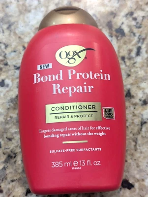 Acondicionador ligero OGX Bond Protein Repair 13 fl oz Foto 1 de 4
