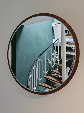 Beautiful round vintage facet cut mirror, mounted on a thick dark wooden Base Cover